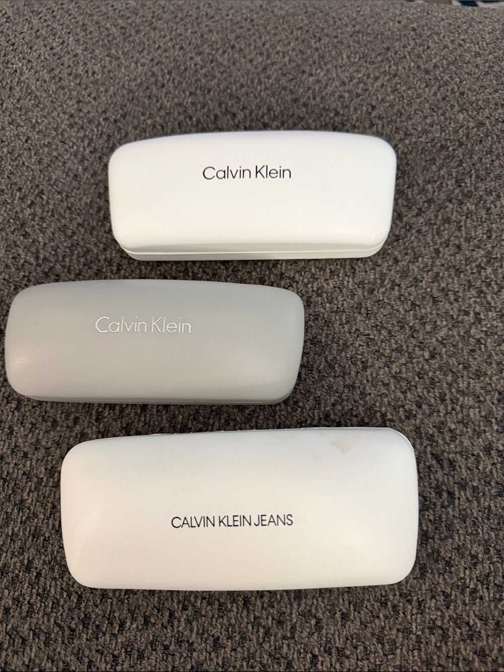3 Calvin Klein White and Light Gray Eyewear Cases